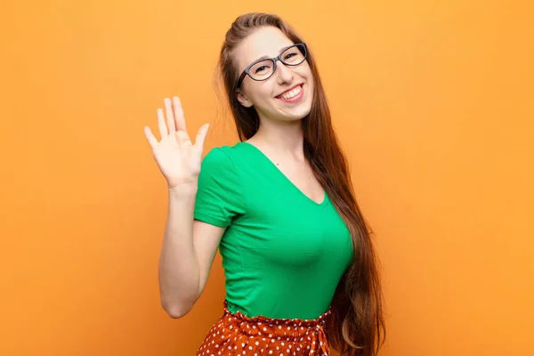 Yound Blonde Woman Smiling Happily Cheerfully Waving Hand Welcoming Greeting — Stock Photo, Image