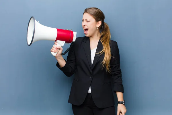 Young Blonde Woman Megaphone Grunge Wall Background — Stock Photo, Image