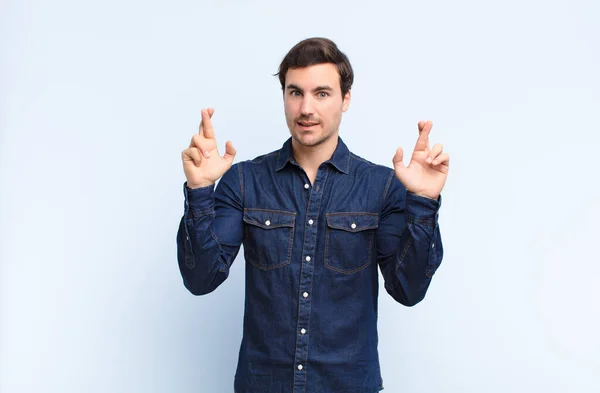 Man Crossing Fingers Anxiously Hoping Good Luck Worried Look — Stock Photo, Image