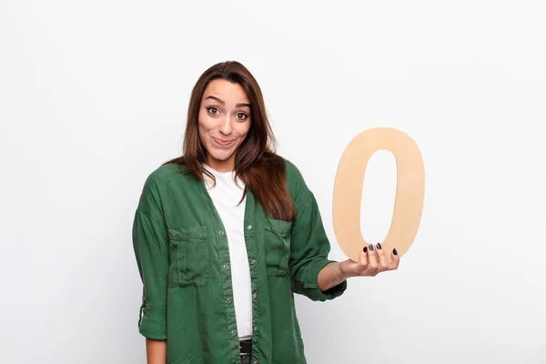 Young Pretty Woman Confused Doubtful Thinking Holding Number — Stock Photo, Image