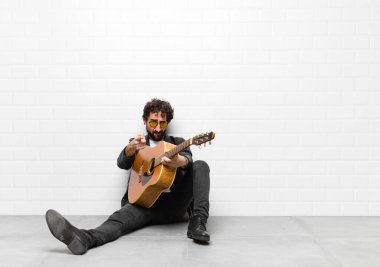 Genç yakışıklı müzisyen. Rock 'n Roll konsepti