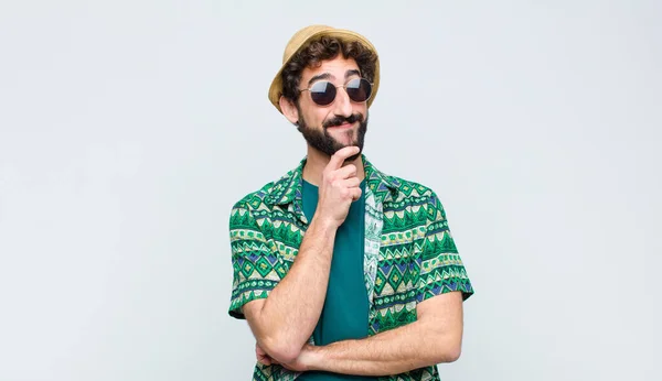 Young Tourist Man Smiling Happily Daydreaming Doubting Looking Side White — Stock Photo, Image