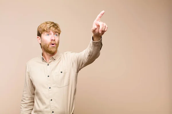 Young Blonde Man Feeling Shocked Surprised Pointing Looking Upwards Awe — Stock Photo, Image