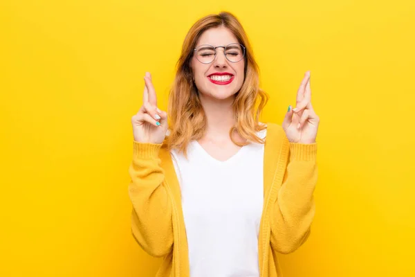 Young Pretty Blonde Woman Feeling Nervous Hopeful Crossing Fingers Praying — Stock Photo, Image