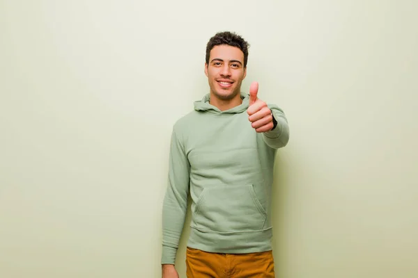 Junger Arabischer Mann Lächelt Und Schaut Freundlich Zeigt Die Nummer — Stockfoto