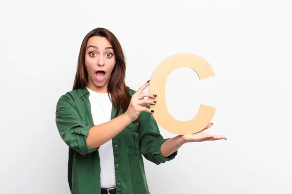Young Pretty Woman Surprised Shocked Amazed Holding Letter Alphabet Form — Stock Photo, Image