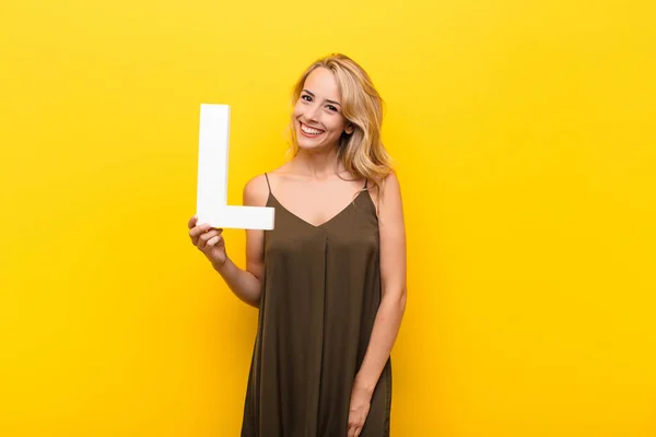 Young Blonde Woman Excited Happy Joyful Holding Letter Alphabet Form — Stock Photo, Image