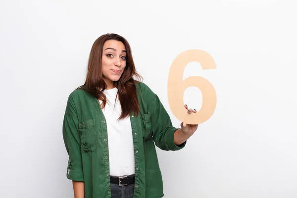 Young Pretty Woman Confused Doubtful Thinking Holding Number — Stock Photo, Image
