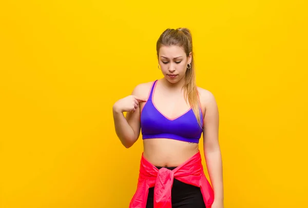 Young Blonde Woman Smiling Cheerfully Casually Looking Downwards Pointing Chest — Stock Photo, Image