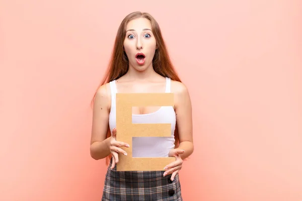 Yound Blonde Woman Surprised Shocked Amazed Holding Letter Alphabet Form — Stock Photo, Image