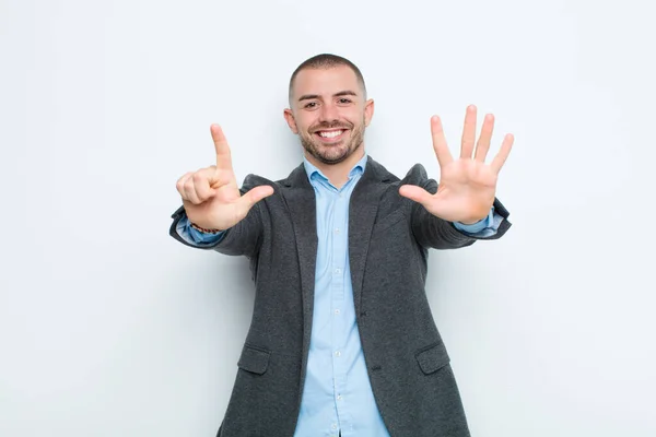 Young Businessman Smiling Looking Friendly Showing Number Seven Seventh Hand — Stock Photo, Image