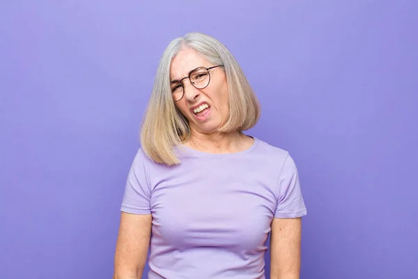 Senior Middle Age Pretty Woman Feeling Puzzled Confused Dumb Stunned — Stockfoto