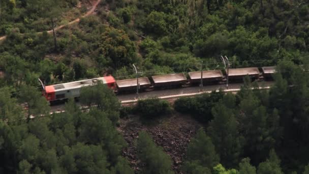 View to the freight train passing by the valley from above in Monistrol de Montserrat, Spain. — Stock Video