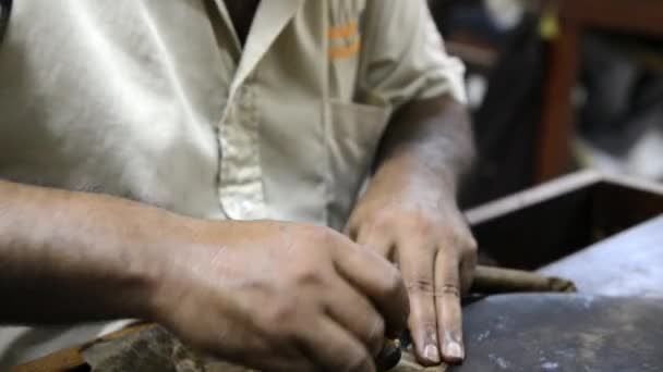 Person produces a cigar in Punto Cana, Dominican Republic. — Stock Video