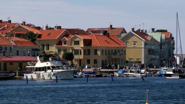 View to the buildings and harbor in the town of Smogen, Sweden. — Stock Video