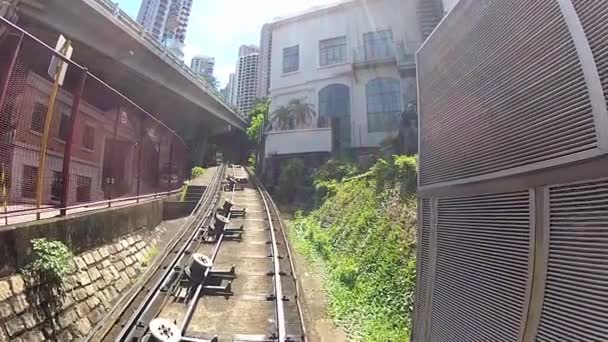 View from the cabin of the Peak tram climbing up to Victoria hill in Hong Kong, China. — Stock Video