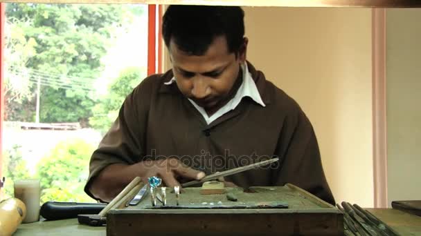 Man polishes ring in a sapphire jewelry workshop in Kandy, Sri Lanka. — Stock Video