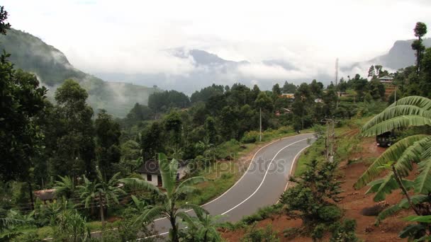 Car passes by the countryside road in Nuwara Eliya, Sri Lanka. — Stock Video