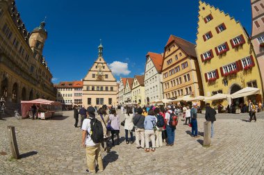 ROTHENBURG OB DER TAUBER, GEMANY - SEPTEMBER 06, 2010: Unidentified people visit Market square in Rothenburg Ob Der Tauber, Germany.