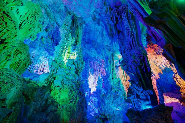 The Reed Flute Cave, natural limestone cave with multicoloured lighting is a landmark and tourist attraction in Guilin, China.