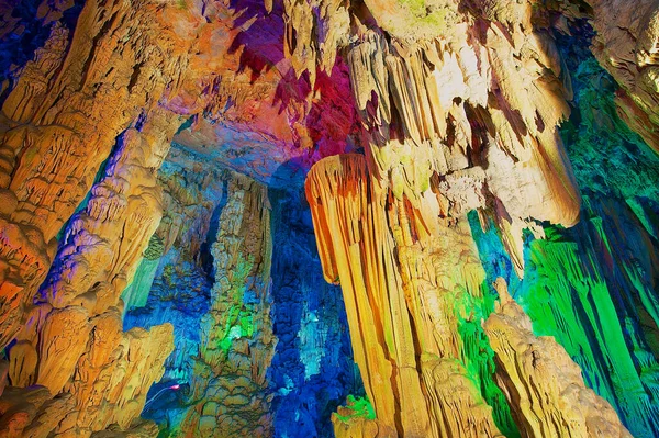 The Reed Flute Cave, natural limestone cave with multicoloured lighting is a landmark and tourist attraction in Guilin, China.