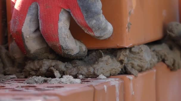 Hands of the Builder Put a Cement Mortar. Hand Makes the Masonry of Brick. — Stock Video