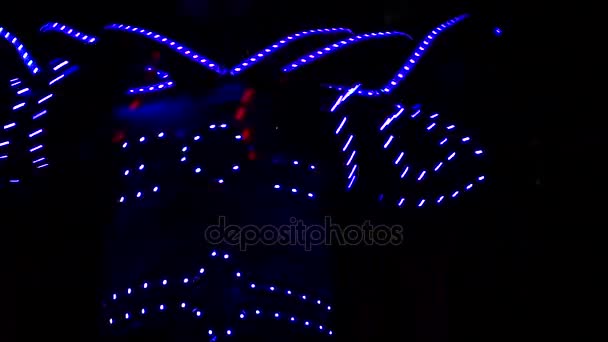 A Clown on Stilts Dancing at Night. Robot Costume. — Stock Video