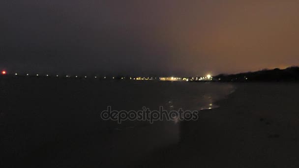 A Lit Lamppost Path in the European Sea at Night With Small Tiding Waves. — Stock Video