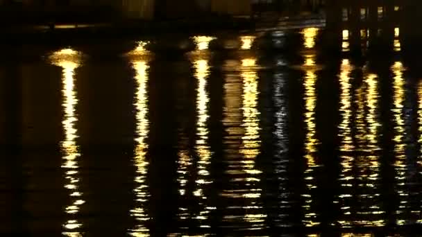 Black Waters of a Theatre Pond With Reflections of Yellow Columns in it and a Quay Nearby — Stock Video