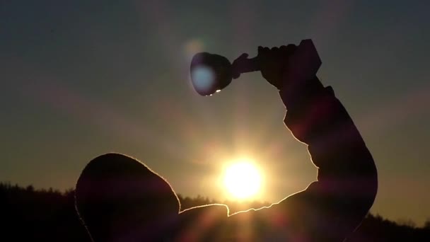 Super Prize in the Hand of Little Boy at Sunset in the Slow Motion. — Stok Video
