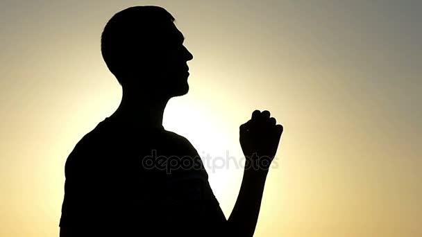 Young Man Makes ok Gesture at Sunset, While Standing in Profile, in Slow Motion — Stock Video