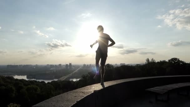 Professional Young man dances happily on an embankment of the Dnipro — Stock Video