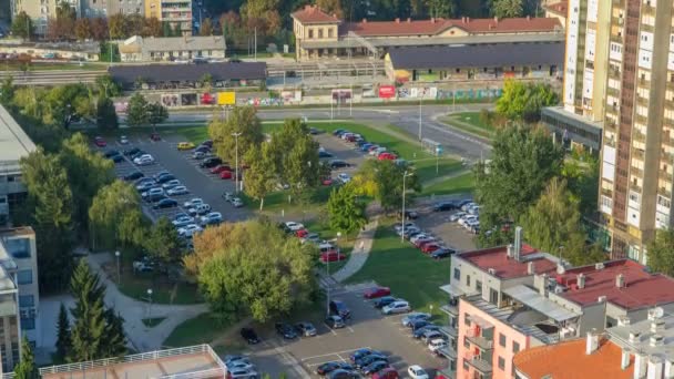 Cars moving on parking lot timelapse with green trees. CROATIA, ZAGREB — Stockvideo