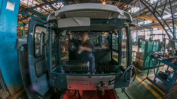 Conveyor assembly stage the body of tractor at factory timelapse — Stock Video