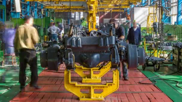 Conveyor assembly stage the body of tractor at factory timelapse — Stock Video