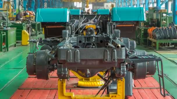 Conveyor assembly stage the body of tractor at factory timelapse — Stock Video