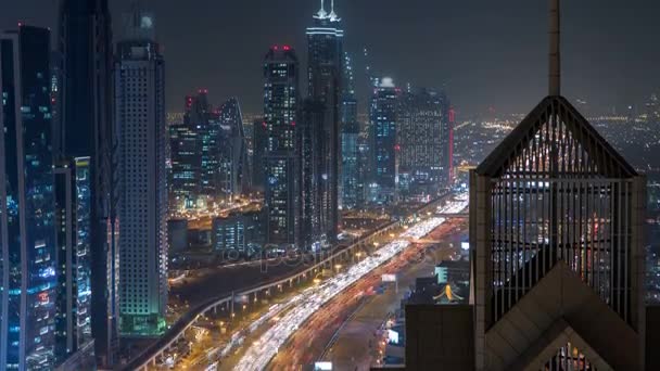 View on modern skyscrapers and busy evening highways night timelapse in luxury Dubai city, Dubai, United Arab Emirates