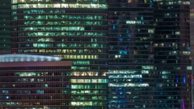 Modern Office Building With Glowing Windows At Night Timelapse Moscow City Glass A Park Where People Relax Modern Office Building With Glowing Windows At Night Timelapse Moscow City Glass A Park Where People Relax