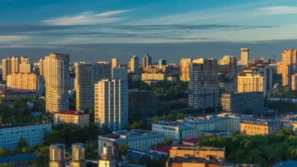 Moscow city bathed in yellow sun at dawn timelapse. An early foggy morning. Shadows moving on houses. Megalopolis aerial view from rooftop. — Stok video