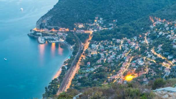 Day to night timelapse view of the Mediterranean coastline of the town of Eze village on the French Riviera — Stock Video