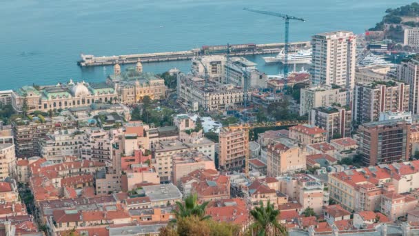 Monte Carlo, Monako gün gece timelapse Cityscape yaz güneş battıktan sonra binaların çatıları ile. — Stok video