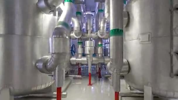 Equipment, cables and piping as found inside of industrial chiller plant room timelapse hyperlapse — Stock Video