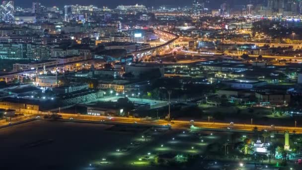 Dubai şehrinin gece ritmi. Havadan zaman ayarlı. — Stok video