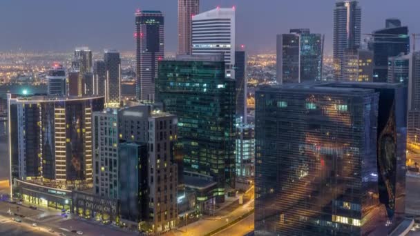 Panorama of Business Bay Dubai night to day air timelapse. — стокове відео