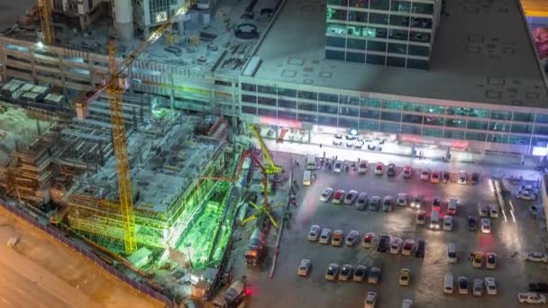 Vista aérea de la construcción con máquinas especiales en Business Bay, Dubai timelapse — Vídeo de stock