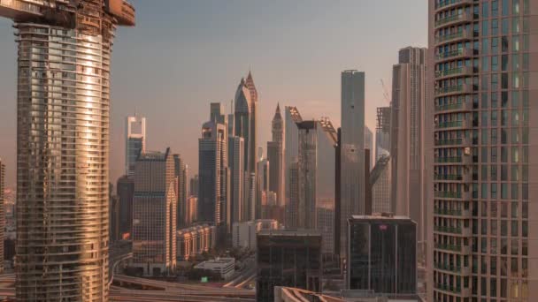 Dubai International Financial Centre district met moderne wolkenkrabbers timelapse bij zonsopgang — Stockvideo