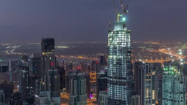 Amazing Flygfoto över Dubai Downtown skyskrapor natt till dag Timelapse, Dubai, Förenade Arabemiraten — Stockvideo