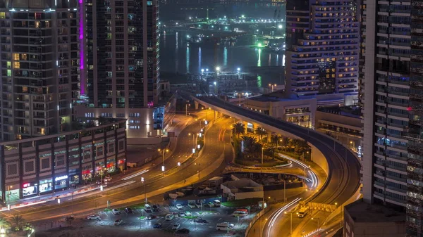 Повітряний вид на хмарочос Дубай з будівельним майданчиком і островом Пальм - Джумейра на задньому плані нічного темпесу.. — стокове фото