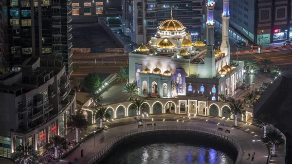 Modern residential architecture of Dubai Marina and Mohammed Bin Ahmed Almulla Mosque aerial night timelapse — Stock Photo, Image