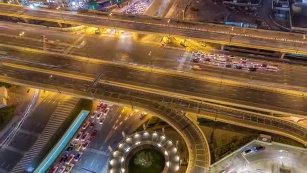 Aerial view of highway interchange in Dubai downtown night timelapse. — Stock Video